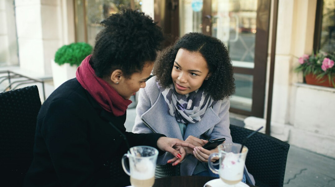 person in deep conversation at cafe